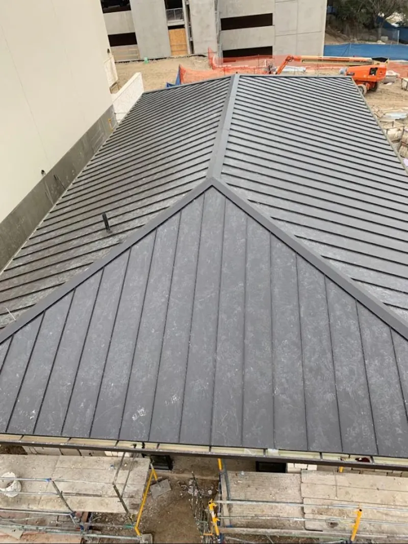 Commercial metal roof construction with crane equipment in Fountain Hills