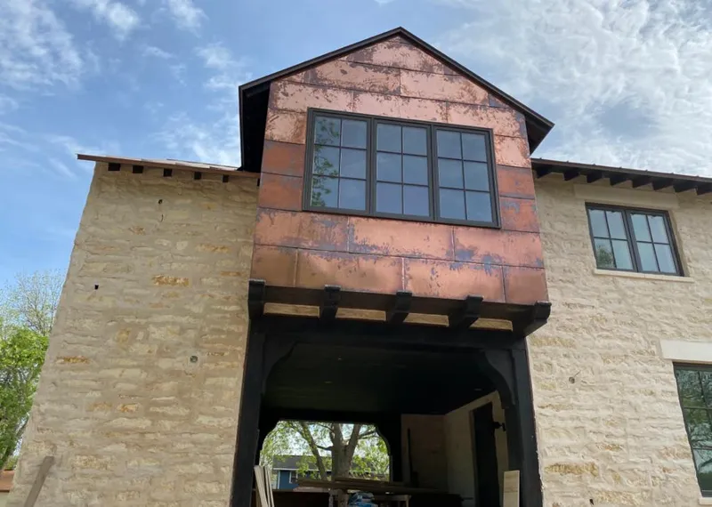 Copper metal panel facade on a stone building for Roof Repair in Fountain Hills